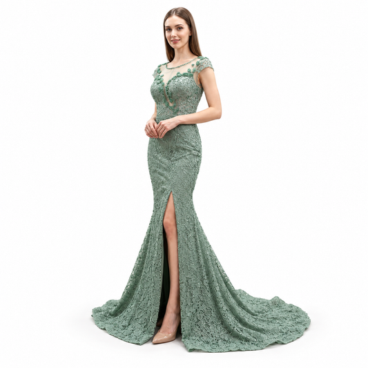 A woman modeling a floor-length sage green lace evening gown with cap sleeves, a high thigh slit, and a slight train against a plain white background.
